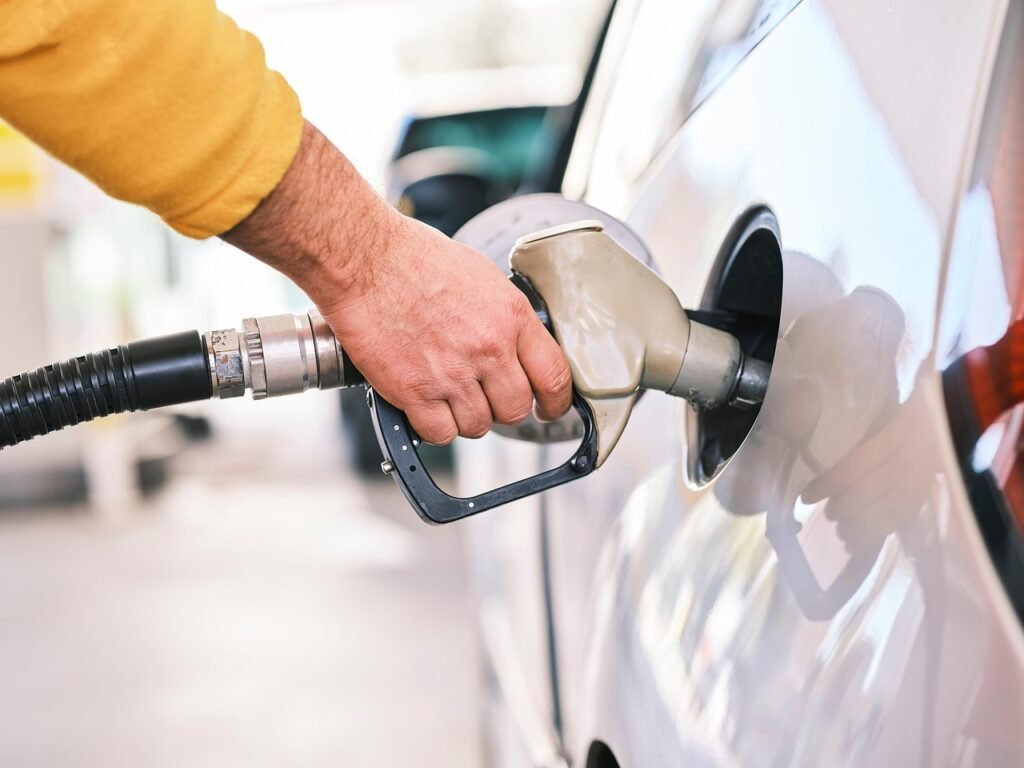 Image of a man fueling his car symbolizing how we need to fuel our bodies properly.