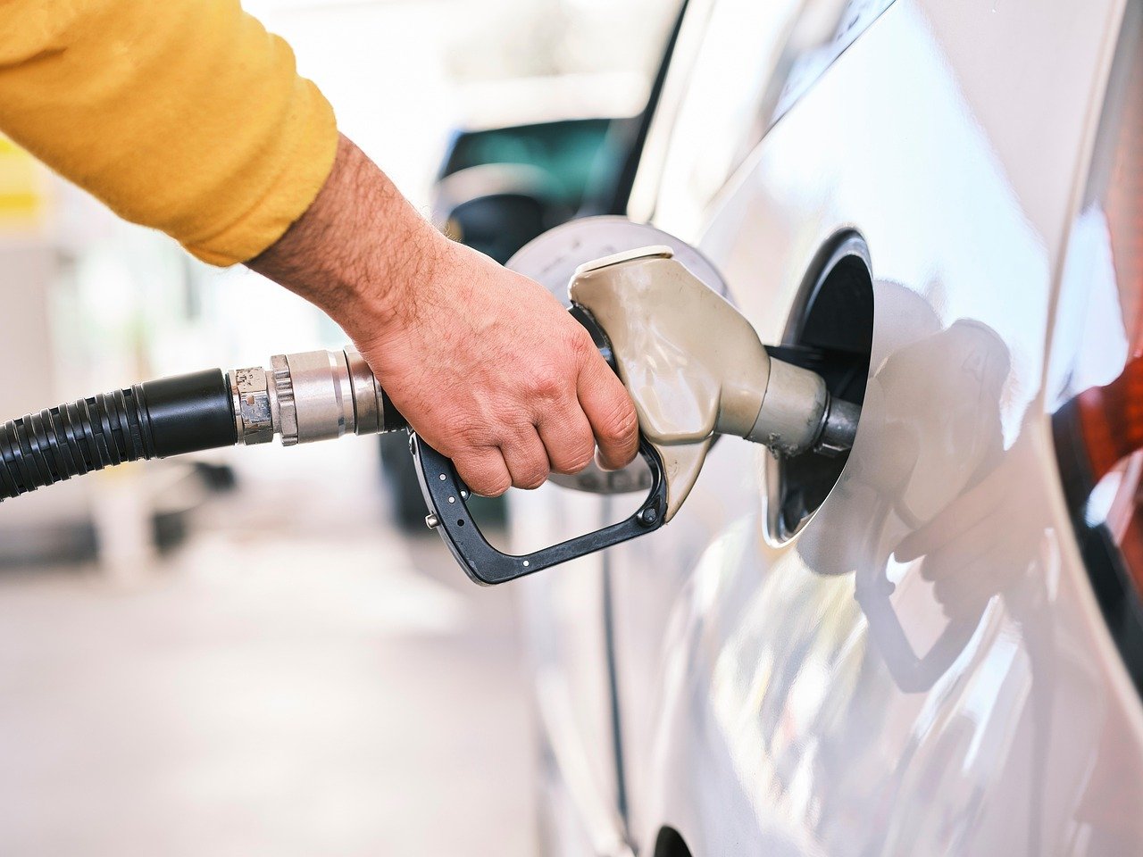 Image of a man fueling his car symbolizing how we need to fuel our bodies properly.