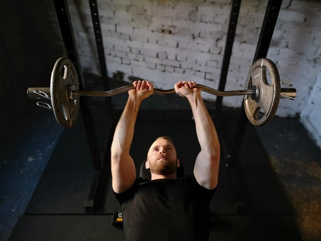 Image of a man lifting weights, illustrating the principle of weight training